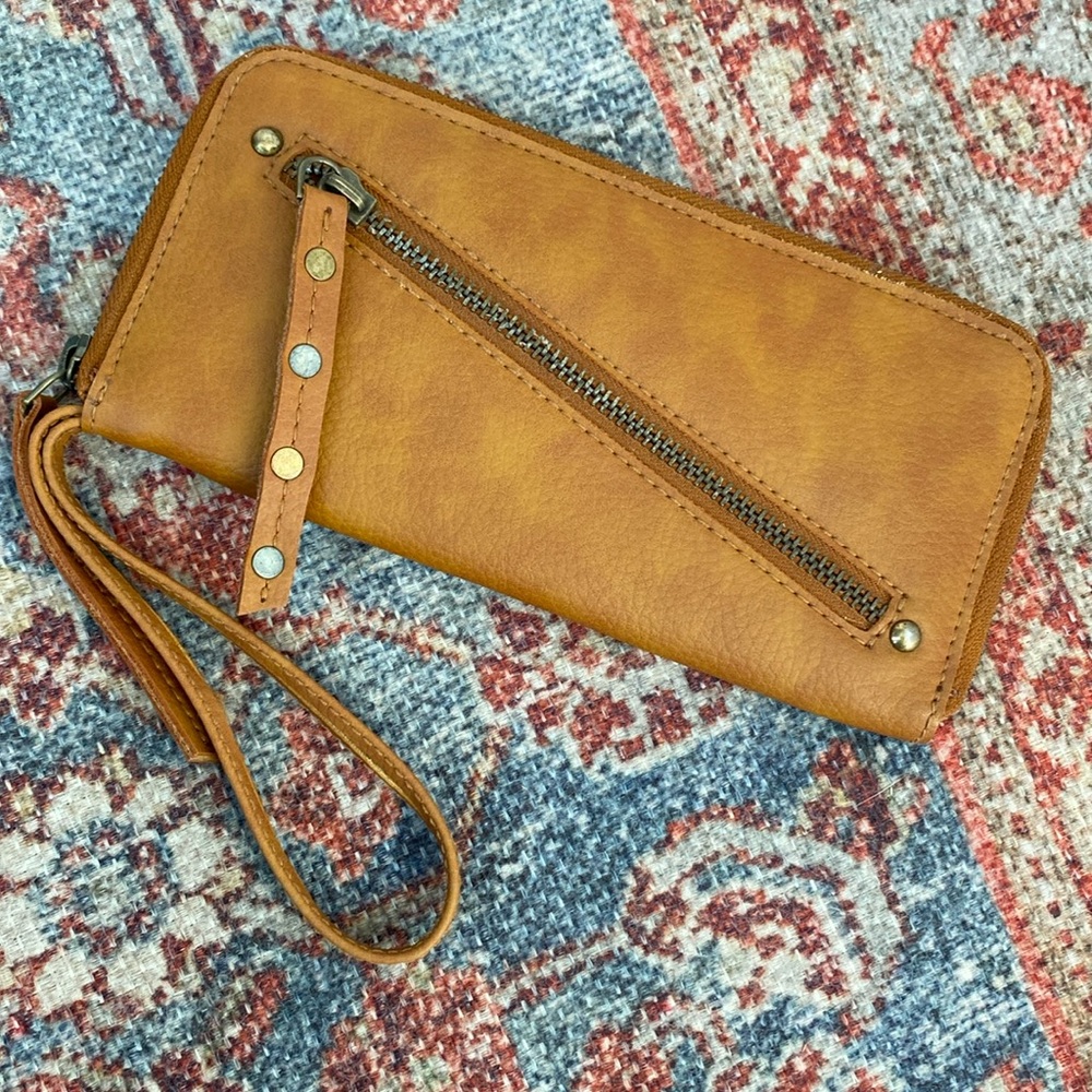 - Free People Distressed Vegan Wallet clutch